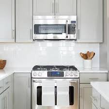 Light grey kitchen cabinets with black handles doorsteptutor. Gray Kitchen Cabinets With Bronze Pulls Transitional Kitchen