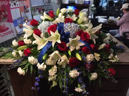 Send the expression of love and sympathy with a beautiful blue and white floral half casket cover. Patriotic Bliss Red White And Blue Casket Spray In Shoals In Chastains Flowers Gifts