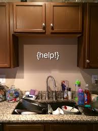 how to decorate behind your kitchen sink