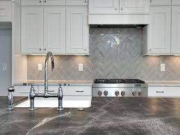A neutral color palette such as the one in this kitchen backsplash can warm up a sleek, contemporary space. 17 Grey Kitchen Backsplash Ideas That Leave You Awestruck Gray Kitchen Backsplash Kitchen Design Kitchen Remodel