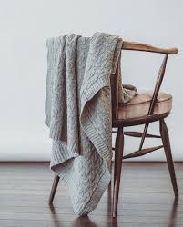 Our 100 Merino Cable Blanket Looking Cozy As Ever I Have These All Around My House And On My Own Bed As Throws In 2020 Throw Blanket Cool Baby Stuff Cables Blanket