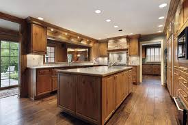 With the contrast between the different types of material in the cabinets and countertops, any kitchen can be transformed with a deep wooden color in the floors. What Color Wood Floor With Dark Cabinets Home Decor Bliss