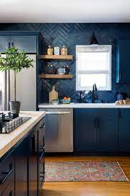 As these cooking spaces prove, this reliably stylish tile has a wall of glossy white subway tiles is just asking to be paired with a timeless dose of colour. Dark Blue Kitchen Cabinets With Blue Tile Backsplash Jenn Feldman Designs Kitchen Backsplash Designs Top Kitchen Designs Kitchen Tiles Design