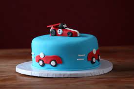 Bakingo offers online delivery of freshly baked designer happy birthday cakes for kids (boys and girls) with same day and midnight delivery options. Racing Car Themed Birthday Cake For A 2 Year Old Little Boy Themed Birthday Cakes Cool Birthday Cakes Cars Birthday Cake