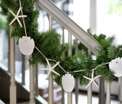 Create a nostalgic and cozy look with christmas garland this holiday season. Coastal Staircase Christmas Garland Ideas Decorations Coastal Decor Ideas Interior Design Diy Shopping