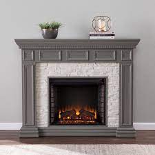 Instantly upgrade the ambiance (and heat) in any room of your house with this electric fireplace from r.w. Southern Enterprises Macksen 50 In Electric Fireplace In Gray With Faux Stone Hd474670 The Home Depot