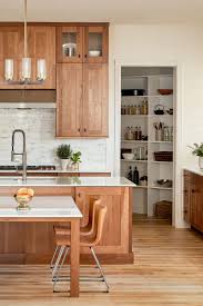 Adding artwork on top of the uppers proves decorative the richly veined marble backsplash perfectly contrasts with the stunning wood cabinetry, made by quebec artisans. 150 Light Wood Kitchens Ideas Light Wood Kitchens Wood Kitchen Wood Kitchen Cabinets
