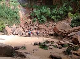 A stream of water descends from the canyon rim down to the virgin river, passing through three tiers of pools. Upper Emerald Pool Trail Reopens Zion National Park U S National Park Service