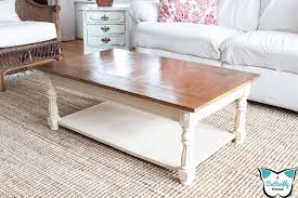 The wood plank table top and contrasting finishes on this rustic coffee table help give it that most sought after country chic vibe. How To Makeover An Ugly Laminate Coffee Table A Butterfly House