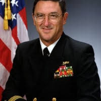 Rear Admiral (lower half) Robert Sutton, USN (covered)