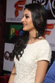 The chic dress had bold stripes in four different colours — white, maroon, blue and mustard. Amyra Dastur Stills Photos Gallery