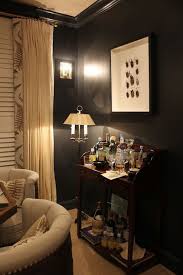 A black statement wall is a great feature for a modern, scandinavian, industrial or masculine interior, it will attract attention and will give your space a relaxing feel. Material Girls Tracker Home Decor Black Game Room With Panther Black Walls Paint Color Paired With Interior Design Interior Home Decor