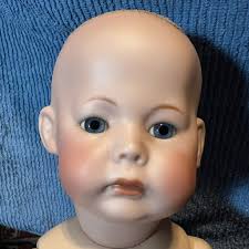 She has an interesting face and costume. Alas. her hair is dissolving.. her  face has almost a compressed chip board feel.. No markings., Please pardon  me if I have posted her before |