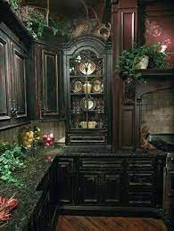 The queens factory showroom in new york city is part of the gothic cabinet craft company, one of the largest manufacturers and retailers of real wood furniture…. Distressed Black Ornate Kitchen Cabinets Dark Granite Countertops And Plenty Of Greenery Gothic Poetry Gothic Kitchen Gothic Home Decor Gothic House
