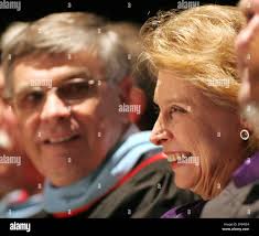 Gov. Christine Gregoire, right, and Dr. James Shoemake, superintendent of  the Tacoma School District, smile while listening to a student speaker  during the graduation of the Tacoma School of the Arts at
