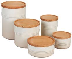 In addition, the collection of colourful storage jars with wooden lids in two sizes are perfect for keeping sugar, tea, coffee or biscuits fresh. Le Creuset Storage Canisters Set Of 5 Meringue Storage Canisters Le Creuset Canisters
