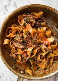 Place chuck steak on large sheet of foil in baking pan. Slow Cooked Shredded Beef Ragu Pasta Recipetin Eats