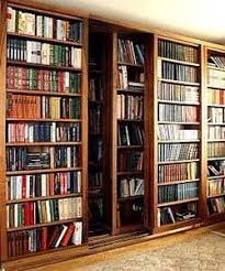 Sliding Bookshelves For The Tiny Library With More Books Than Space Home Library Design Large Bookcase Home Library