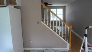 I think the white ballusters would look better. Out With Oak Banister Makeover The Newlyweds