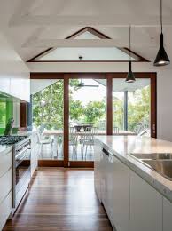 Bright Light Kitchen With Exposed Raked Ceiling Home Ceiling Beams Interior Architecture