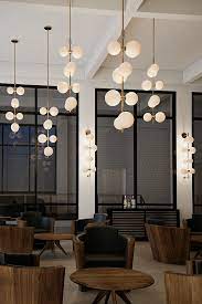 The Aged Brass Modernrail Wall Light By Tech Lighting Showcases The Sophistication Of Modernrail B Living Room Lighting Design Hotel Light Geometric Chandelier