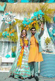 Photo Of Matching Bride And Groom In Mustard And Teal Outfits Indian Wedding Outfits Couple Wedding Dress Indian Bride Outfits