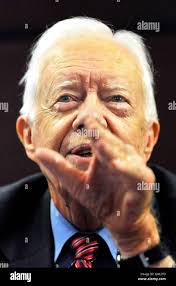 Former U.S. President Jimmy Carter, center left, walks with Panama's  Foreign Minister Samuel Lewis Navarro upon his arrival to Tocumen  international airport in Panama City, Sunday, Sept. 2, 2007. Carter is in