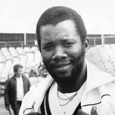 Malcolm Marshall Kisses Daughter Mali 1990. Art Prints, Posters & Puzzles  from Memory Lane