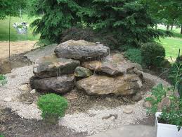 Imagine yourself floating in a tranquil pool of warm, clear blue water, listening to the soothing sounds of a waterfall. B T Klein S Landscaping Water Features Hand Carved Natural Stone Fountains
