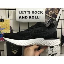 Nike's epic react flyknit sneakers feature a new react sole that's 13 percent more responsive than lunarlon, and looks to dethrone adidas ultra boost. Nike Epic React Flyknit Black White Men Running Shoes