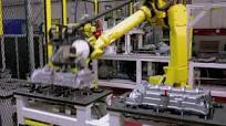 Multi-Robot Engine Cover Assembly System – TranTek Automation