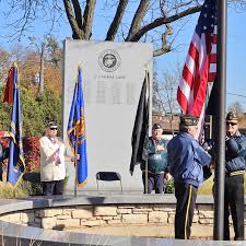 Veterans Day ceremony in Franklin Park includes new names added to memorial  monument