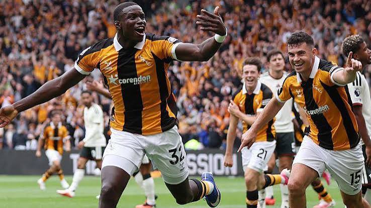 Hull City players celebrate their second goal against Manchester United