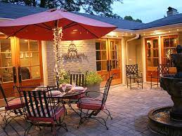 A small yet cozy inner courtyard with lots of greenery and grass lit through perforated panels above. Cozy Intimate Courtyards Hgtv