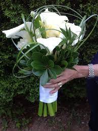White Canadian Calla Lilies Double Freesia Italian Ruscus Green Pittosporum And Bear Grass Beautiful Bouquet Italian Ruscus Wedding Bouquets