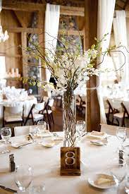 Orchid And Willow Branch Centerpieces Willow Branch Centerpiece Branch Centerpieces Tall Wedding Centerpieces