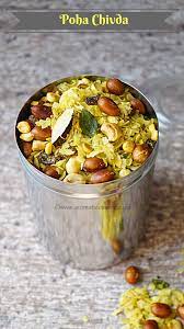 Poha Chivda Is Basically A Sweet And Spicy Indianized Version Of A Trail Mix Poha Flattened Rice Is Combined With Indian Food Recipes Poha Recipe Recipes