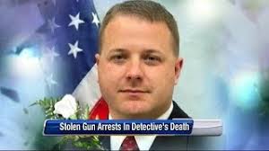 4 arrested in stolen gun used to kill detective