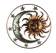 Very peaceful handcrafted wall sculpture. Direct International Metal Celestial Sun Moon And Stars Indoor Outdoor Wall Sculpture Home Kitchen Sculptures