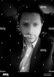 Sitting in white car Black and White Stock Photos & Images