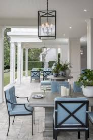 Gray Outdoor Dining Table With Wrought Iron Dining Chairs And Blue Cushions Cottage Deck Patio Outdoor Living Space Outdoor Rooms Patio Design