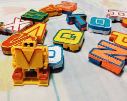 Colgate's letrabots weren't just alphabet shapes that transform into . Alphabet Robots Wifely Steps