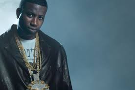 The right side of his neck contains a tattoo of a scener of a boat sailing in the sea with the sun behind it. Gucci Mane Gets New Ice Cream Face Tattoo Billboard