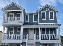 Blue spa paint color scheme in a home by the sea. Marnie S Favorites Coastal Front Door Exterior Paint Colors Marnie Custom Homes