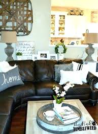 I think leather is having a come back (especially streamlined beauties like our new leather sectional at the ranch), but big brown beasts can be tricky to decorate either way. Inspirational Living Room Ideas Living Room Design Dark Brown Leather Sofa Living Room