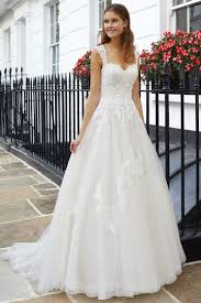 Browse our pretty lace wedding gowns in simple designs, short cuts, & long sleeves, all in plus & petite sizes! Cut Outs Bridal Dresses Lillian West