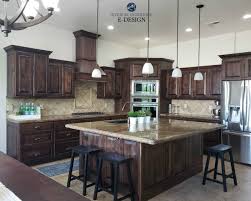 Use this designer tip to add some visual spice to a kitchen filled with neutral countertops and cabinets: Dark Cabinets With White Walls Novocom Top