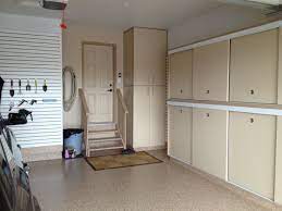 Gerry Garage Slotwall Epoxy Floor Custom Cabinets Sliding Doors Built In Drawers Calgary Garage Garage Storage Cabinets Custom Cabinets Sliding Doors