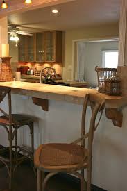 Opening up the dividing wall will spice up the décor and make things convenient. Stone Bar With Pass Through To Kitchen Kitchen Remodel Kitchen Bar Trendy Kitchen