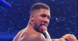 Anthony Joshua's tongue gesture explained after 'taunting fans' during  fight